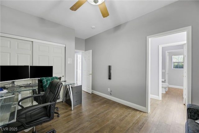 office featuring wood-type flooring and ceiling fan