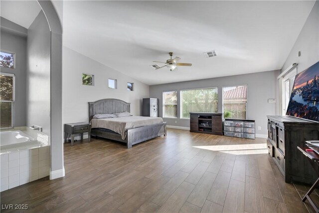 bedroom featuring vaulted ceiling, ceiling fan, and dark hardwood / wood-style floors