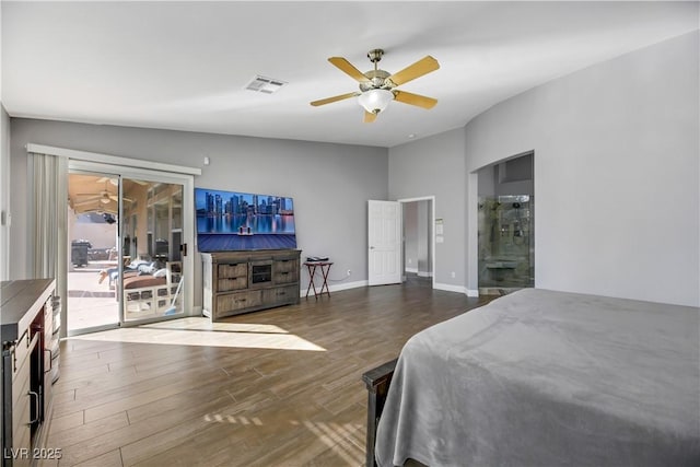 bedroom with lofted ceiling, dark wood-type flooring, ensuite bath, ceiling fan, and access to exterior