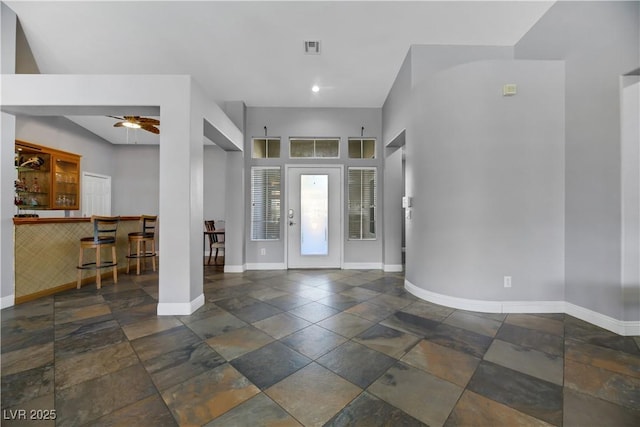 foyer featuring ceiling fan