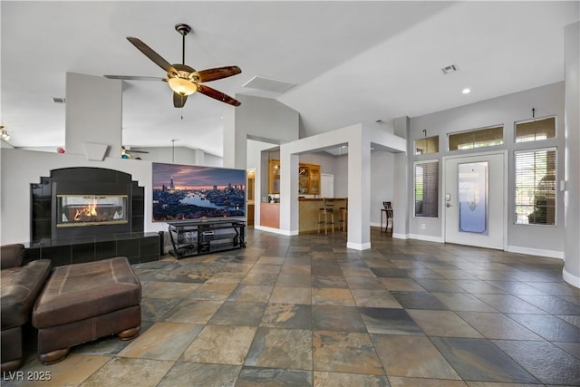 living room with vaulted ceiling and ceiling fan