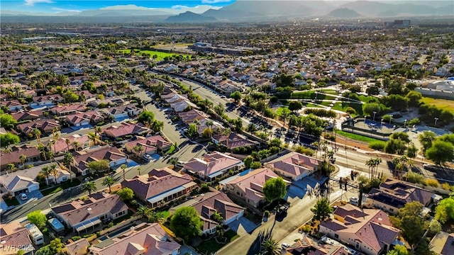 birds eye view of property with a mountain view