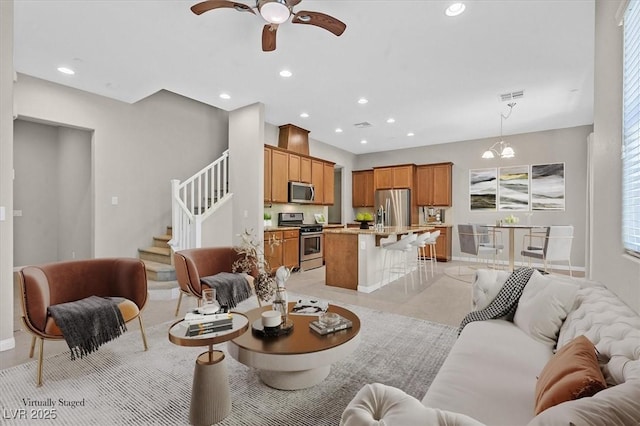 10375 Pescado Ln, Las Vegas, NV 89135 - living area with ceiling fan, recessed lighting, healthy amount of natural light, and stairway