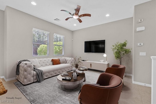 living room featuring ceiling fan and light tile patterned floors