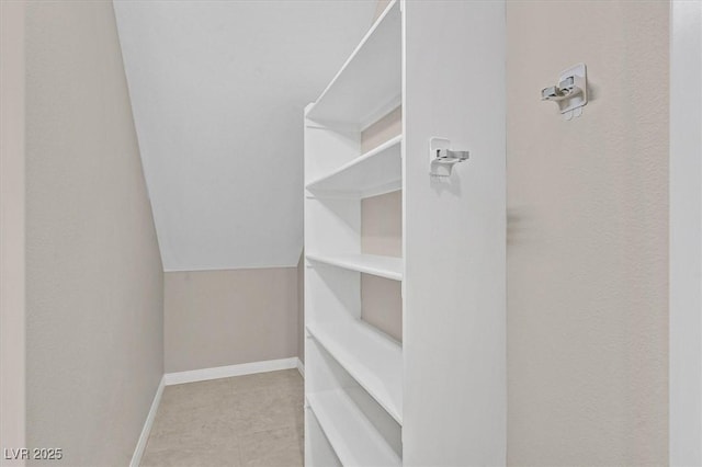 spacious closet with vaulted ceiling