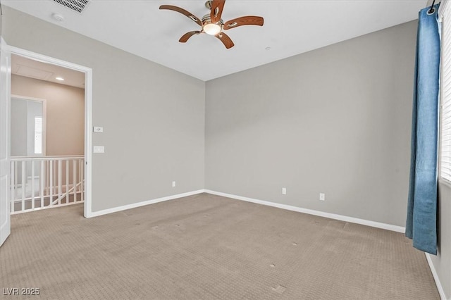 unfurnished room featuring ceiling fan and light colored carpet