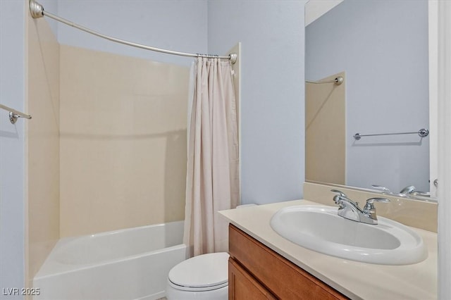 full bathroom with vanity, shower / bath combo, and toilet