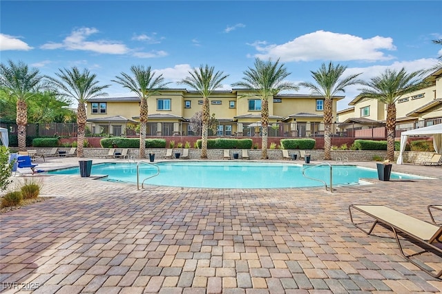 10375 Pescado Ln, Las Vegas, NV 89135 - community pool with a patio and a residential view