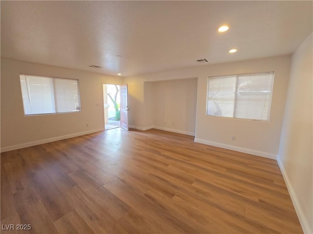 empty room featuring hardwood / wood-style flooring