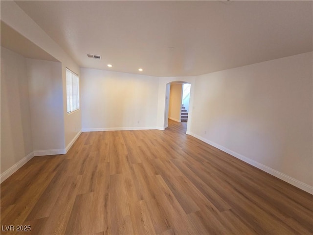 spare room with light hardwood / wood-style flooring