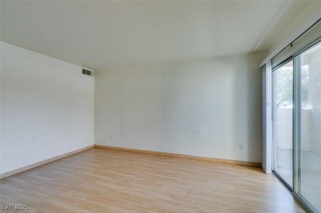 spare room with light hardwood / wood-style floors