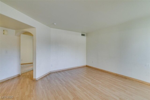 unfurnished room featuring light hardwood / wood-style floors