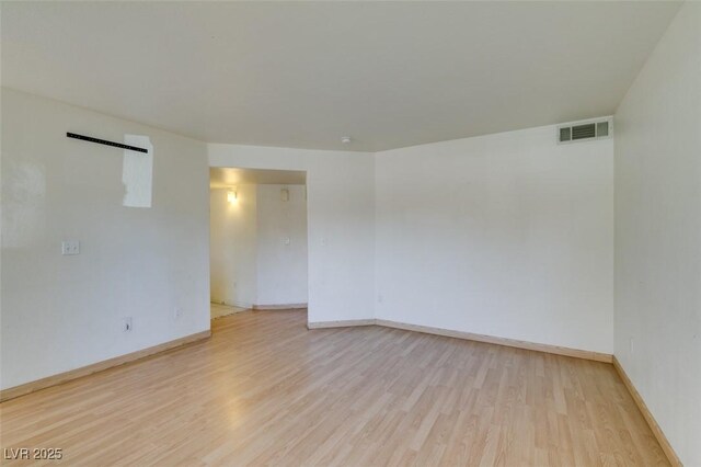 spare room with light hardwood / wood-style flooring