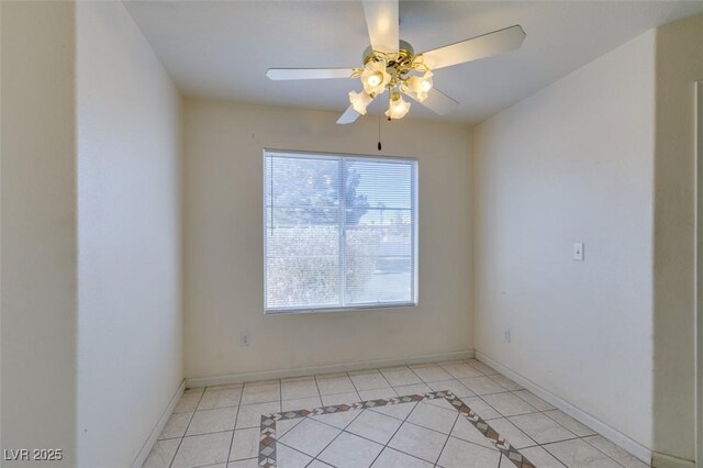 empty room featuring light tile patterned floors and ceiling fan