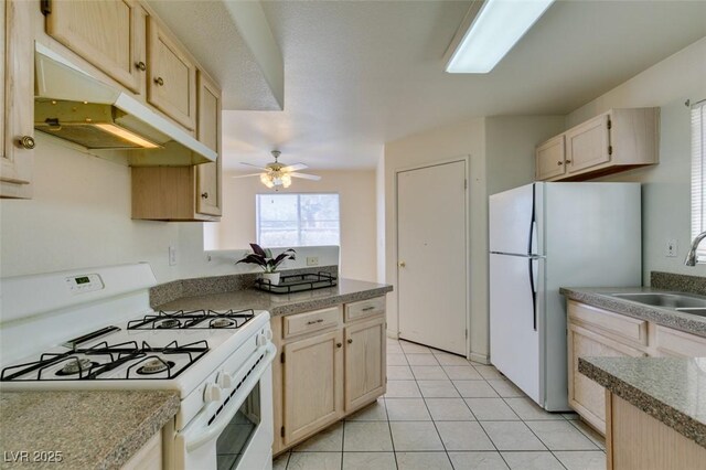 kitchen with ceiling fan, sink, white appliances, light brown cabinetry, and light tile patterned floors