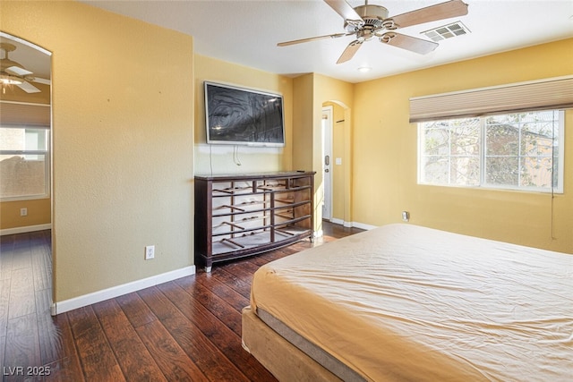 bedroom with ceiling fan and dark hardwood / wood-style floors