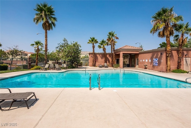 view of swimming pool with a patio