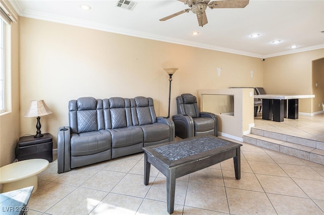 living room with ceiling fan, ornamental molding, and light tile patterned flooring