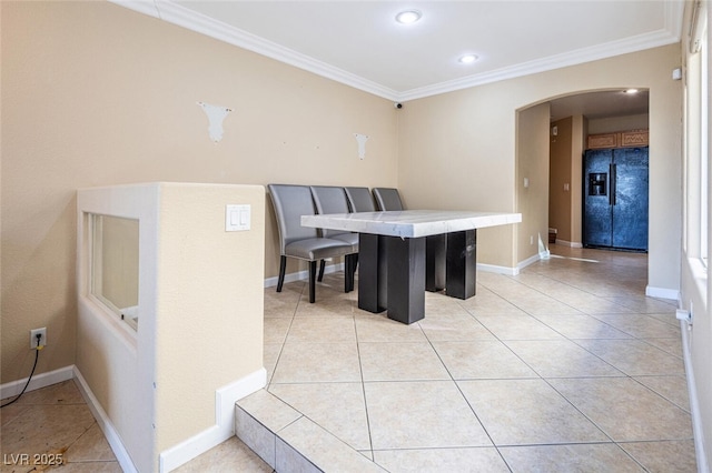 tiled dining area with crown molding