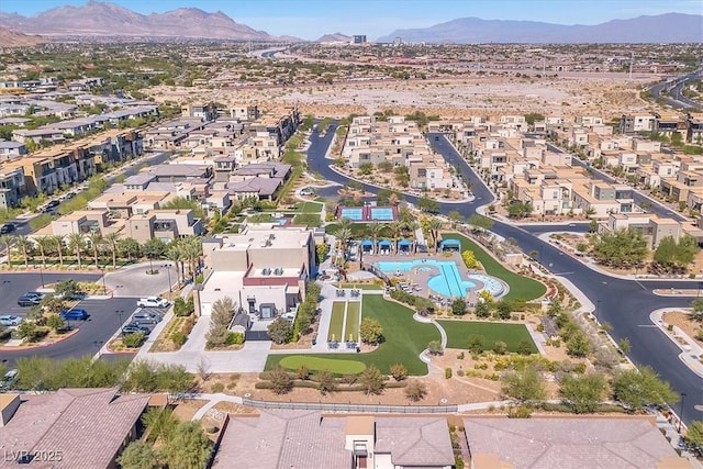 birds eye view of property with a mountain view