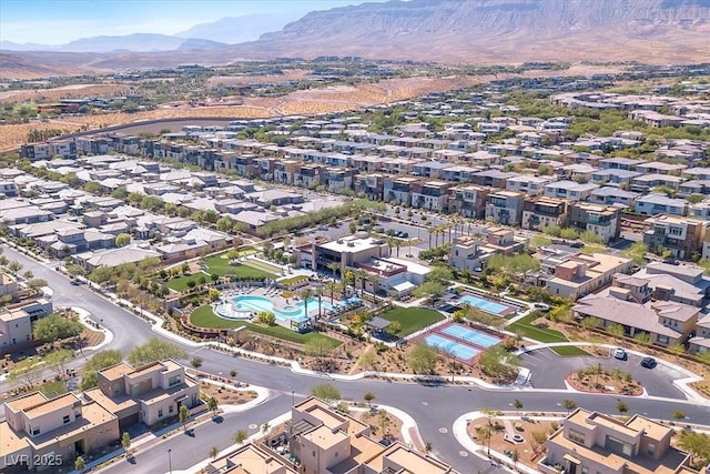 birds eye view of property featuring a mountain view