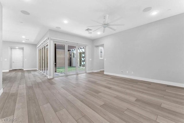 unfurnished room featuring ceiling fan and light hardwood / wood-style flooring