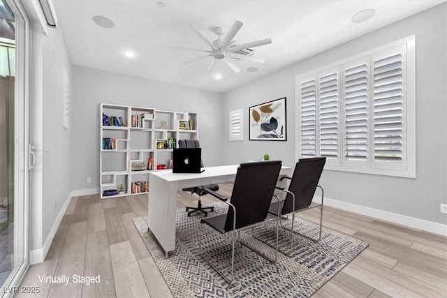 office space featuring ceiling fan and light hardwood / wood-style floors