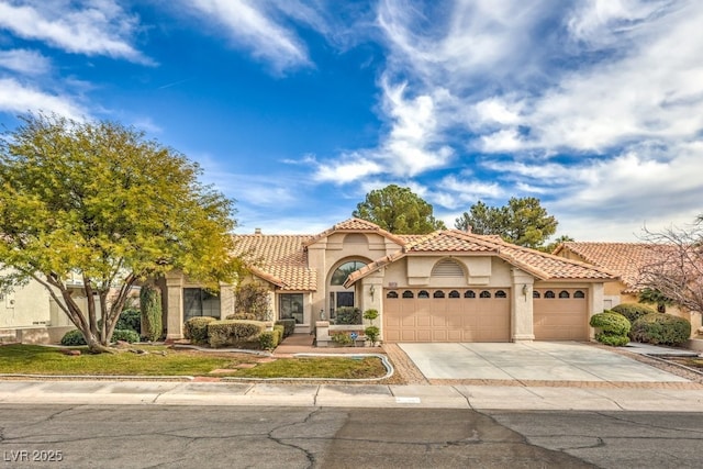 mediterranean / spanish house featuring a garage