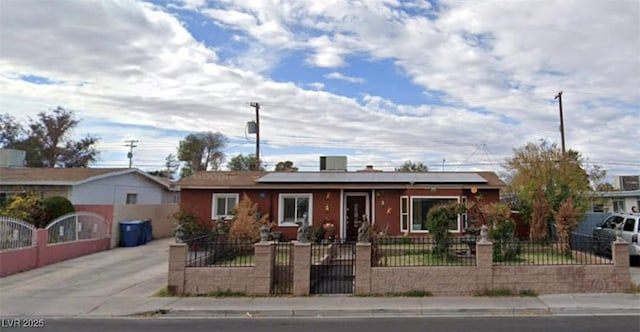 ranch-style home with solar panels