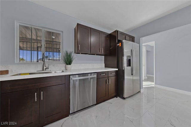 kitchen with sink, stainless steel appliances, and dark brown cabinets