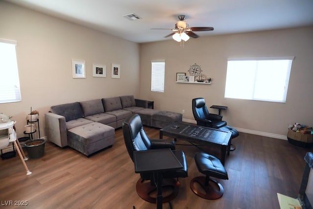 living room with ceiling fan and wood-type flooring