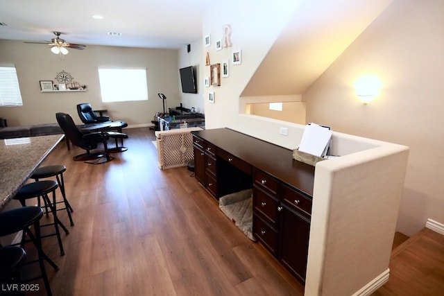 home office with hardwood / wood-style flooring and ceiling fan