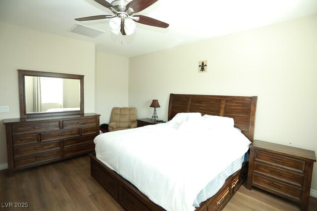 bedroom featuring ceiling fan and dark wood-type flooring