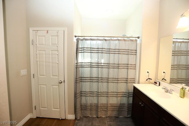 bathroom with wood-type flooring and vanity