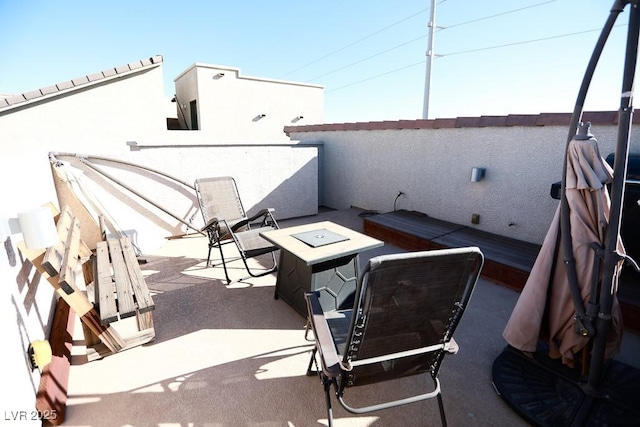 view of patio / terrace with a fire pit