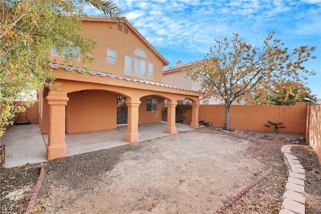 back of house featuring a patio