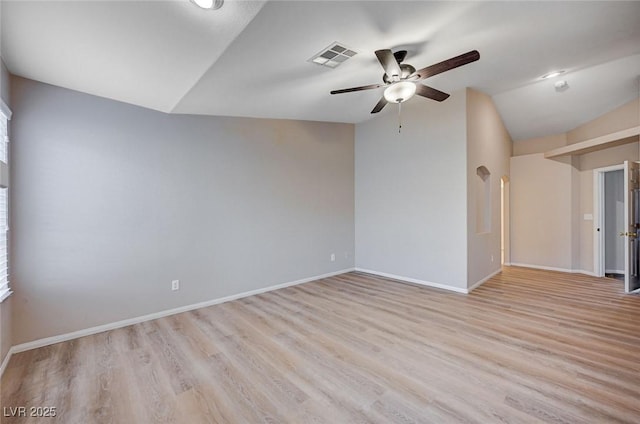 unfurnished room with vaulted ceiling, light hardwood / wood-style flooring, and ceiling fan