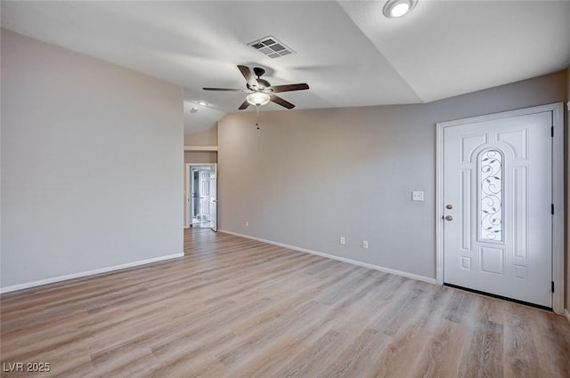 entryway with ceiling fan, light wood-type flooring, and lofted ceiling