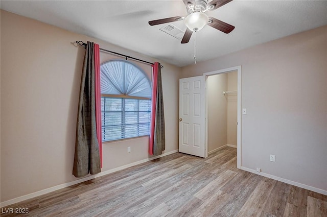 interior space with ceiling fan and light wood-type flooring