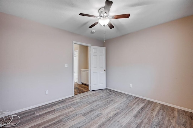 unfurnished bedroom with hardwood / wood-style flooring and ceiling fan