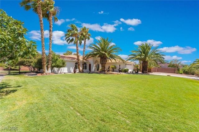 mediterranean / spanish home featuring a front yard