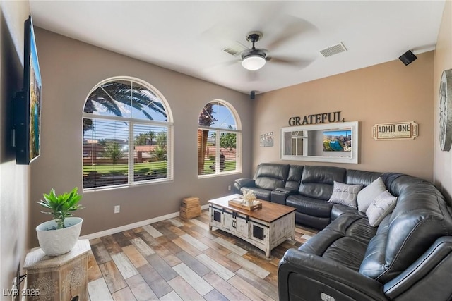 living room featuring ceiling fan and light hardwood / wood-style floors