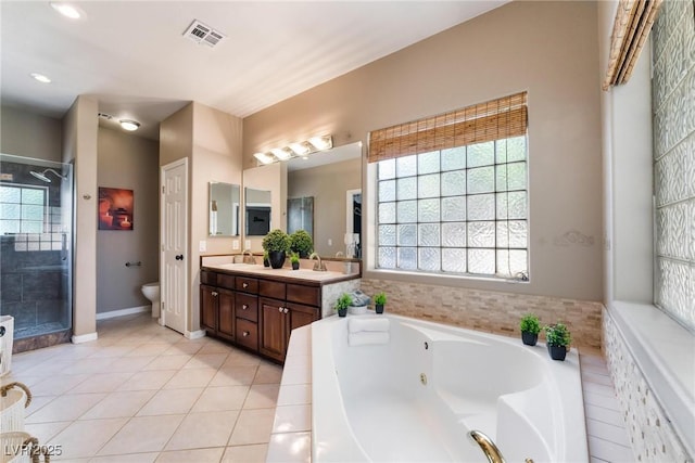 bathroom featuring separate shower and tub, tile patterned flooring, and vanity