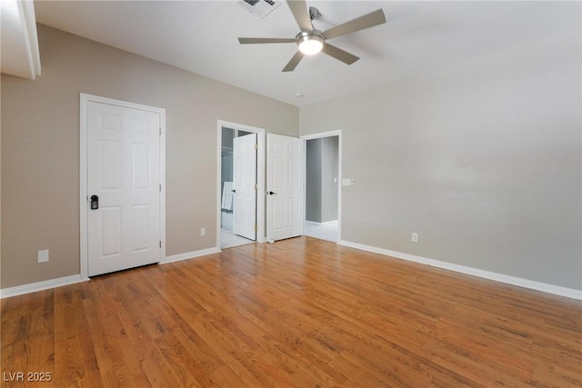 unfurnished bedroom with ceiling fan and light hardwood / wood-style floors