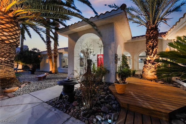 view of patio terrace at dusk