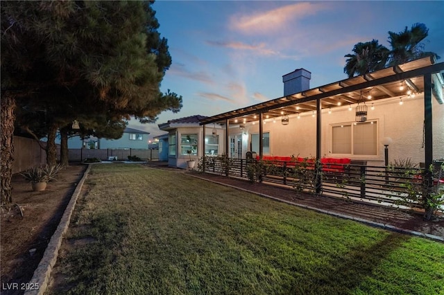 view of yard at dusk