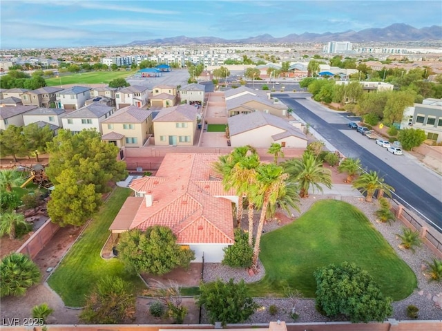 birds eye view of property with a mountain view