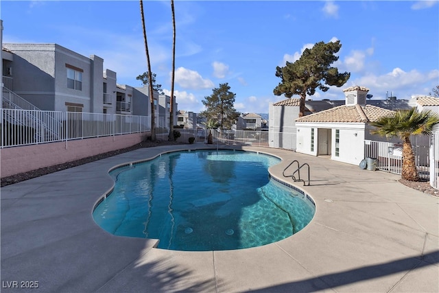 view of swimming pool with a patio