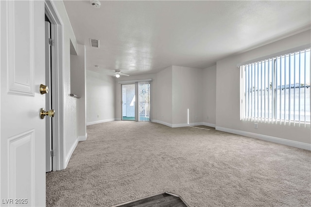 unfurnished room featuring carpet floors and ceiling fan