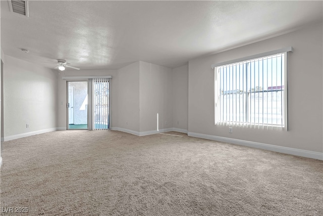 carpeted empty room with ceiling fan